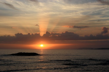 Romantic sunset at the ocean shore 