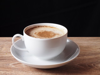 A cup of coffee with cinnamon