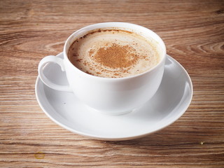 A cup of coffee with cinnamon