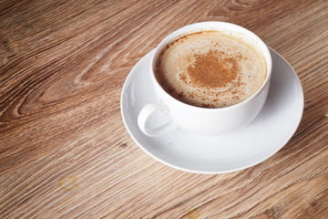A cup of coffee with cinnamon