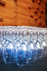 Wine glasses in row, turned upside down on the table