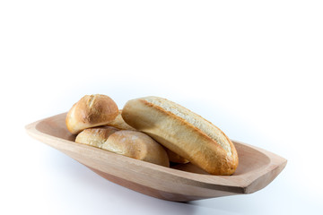 Mini French Baguettes on a rectangular wood bowl with white background -  angle 2