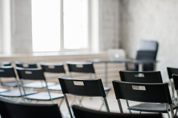 Blur Class room chair and table with white board and projector screen. white black colour concept.