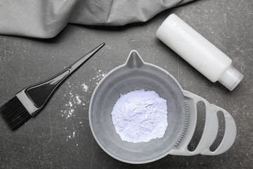 Professional kit for hair dyeing on dark background