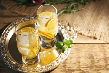 Glasses with delicious wine spritzer on silver tray