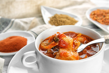 Soup pot with chicken tikka masala, closeup