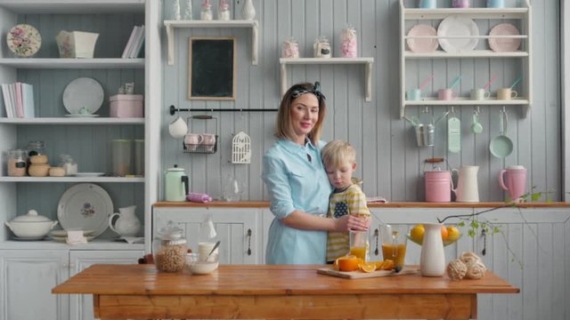 Mom Son Spend Time Holiday Eating Breakfast, mother and boy child on kichen, happy family