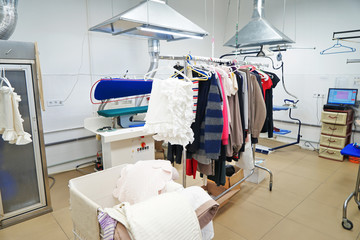 Cleaning service concept. Dry cleaner's workshop