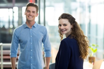 Portrait of business executives standing in office