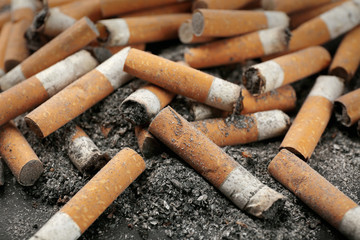 Closeup view of dirty cigarette butts