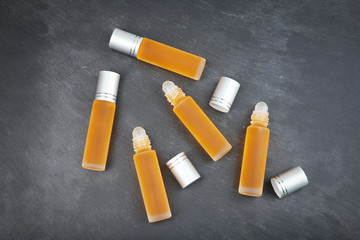 Bottles with perfume on grunge background