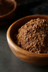 Bowl with cocoa powder, closeup