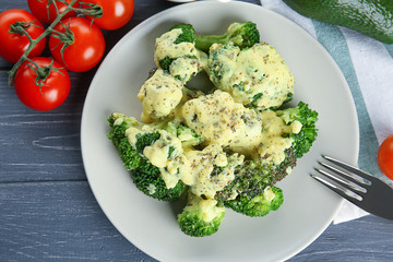 White plate of delicious broccoli with cheese cream, closeup