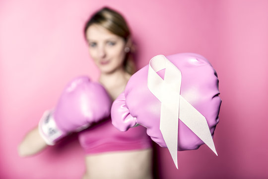 Fight for Breast Cancer woman with symbol on pink background