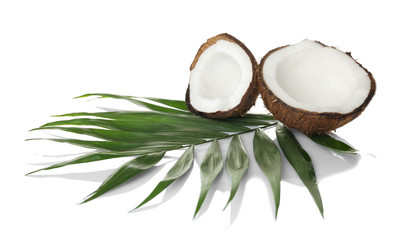 Fototapeta na wymiar Coconut and palm leaf on white background