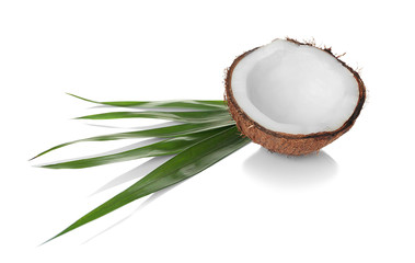 Coconut and palm leaf on white background
