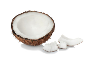 Coconut half and pieces on white background