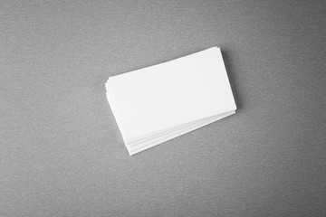 Blank paper cards for branding on grey background