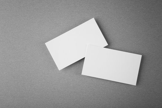 Blank paper cards for branding on grey background