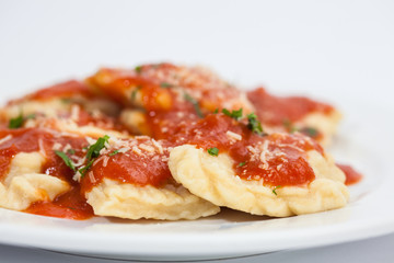 Ravioli Preparation : Cooked and served homemade ravioli with tomato sauce