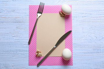 Beautiful Easter composition with empty card on wooden background