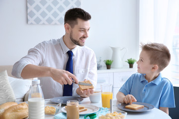 Dad and son having lunch at home