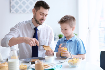 Dad and son having lunch at home