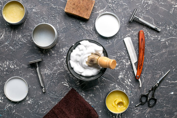 babrer workplace with tools on gray background top view