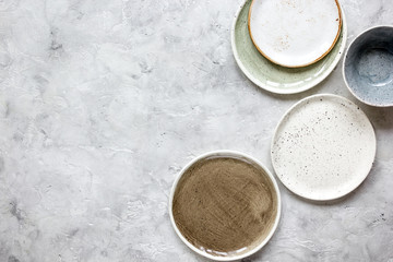 ceramic tableware top view on stone background mock up