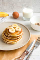 cooked pancake on plate at wooden background