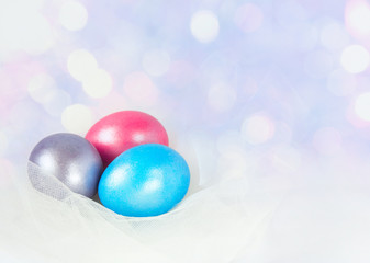 Colorful easter eggs on a white background. Selective focus and space for text.