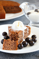 Homemade coffee pie with poppy and ice cream  on a white plate. Selective focus