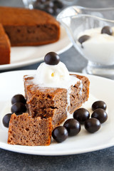 Homemade coffee pie with poppy and ice cream  on a white plate. Selective focus