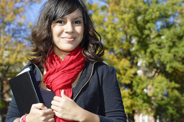 Female Latino college student on campus