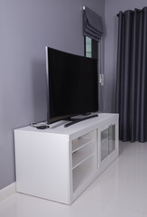 Fototapeta na wymiar LED TV on white stand