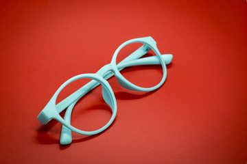 Modern fashionable spectacles on red background, Glasses