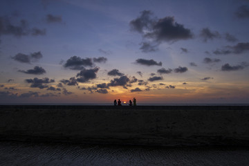 Fototapeta na wymiar Two couples and the Sunset
