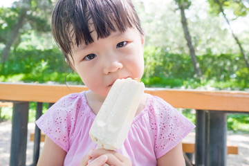 cute girl eat popsicle