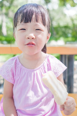 cute girl eat popsicle