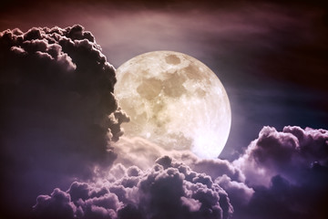 Obraz premium Nighttime sky with clouds and bright full moon with shiny. Vintage tone effect.