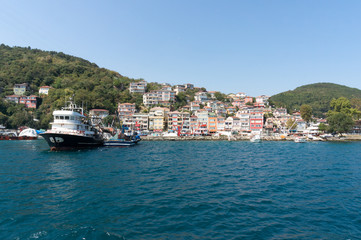 Fototapeta na wymiar Cityscape of Istanbul suburbia and fishing boat with trailer