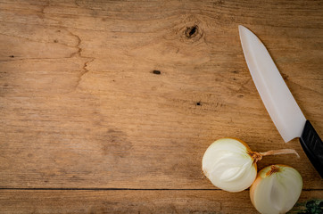 Onion on brown wood