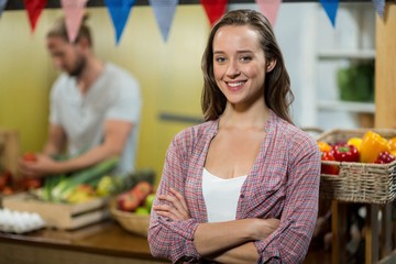 woman vendor standing in the grocery store 