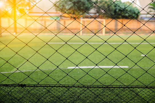 view through a mesh fence artificial turf