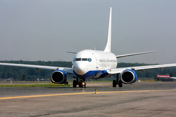 Passenger aircraft moves on the main taxiway