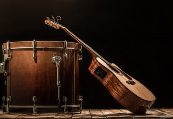 musical instruments, drum bass and acoustic guitar on a black background