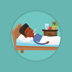 Sick man with thermometer laying in bed.