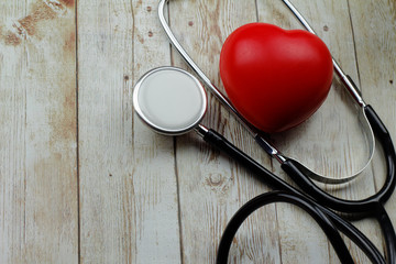Stethoscope with red heart symbol. Conceptual