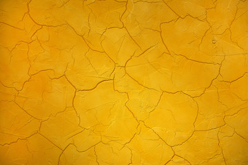 Crackle or cracked paint texture in bright yellow
