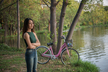 Young pretty girl was sad standing in the park she was disappointed and lonely.